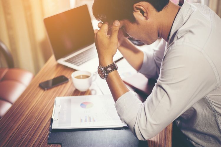 Man at desk facing stress - CC0 Creative Commons via Pixabay