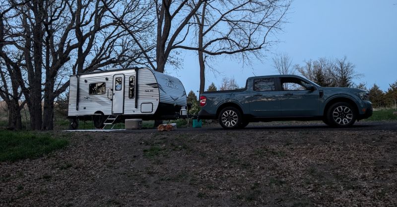 Jayco Travel Trailer and Ford Maverick at campsite