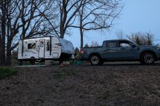 Jayco Travel Trailer and Ford Maverick at campsite